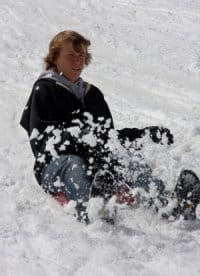 snow1-1 Boy sliding down a snowy hill